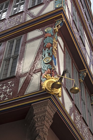 Corner detail of a colorful half timbered house, house to the Golden Libra, in the new historic old