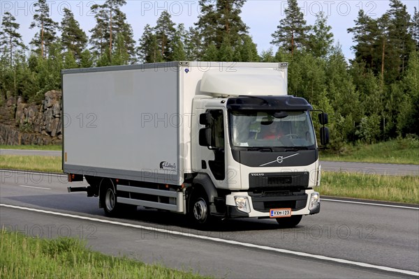 PAIMIO, FINLAND, JUNE 3, 2016: White Volvo FE delivery truck transports goods along motorway at