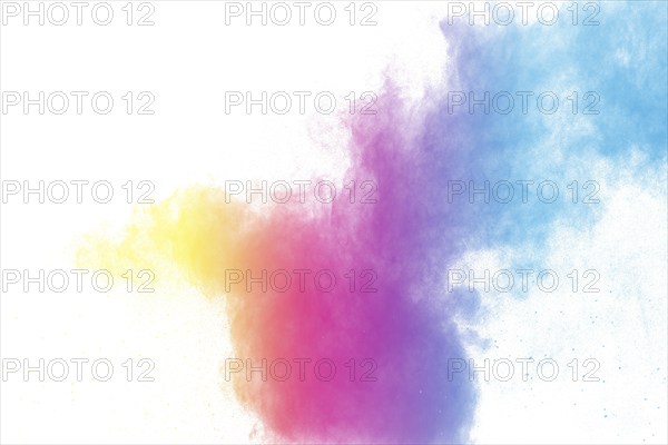 Abstract color powder explosion on white background.Freeze motion of dust splash. Painted Holi in