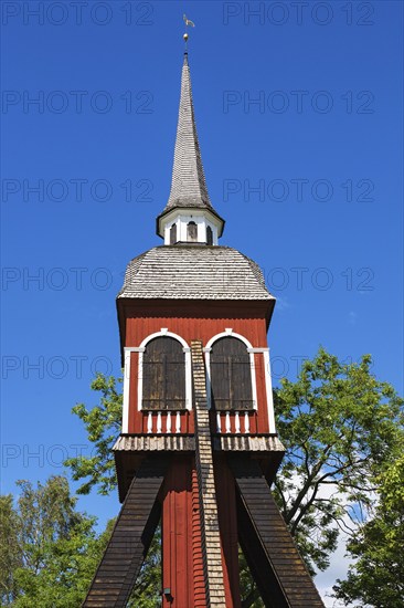 Old wooden belfry in summer