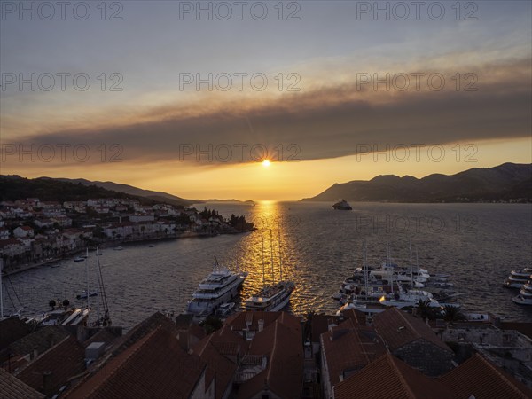 Evening atmosphere in front of sunset, view from the bell tower, Korcula harbour, Korcula island,