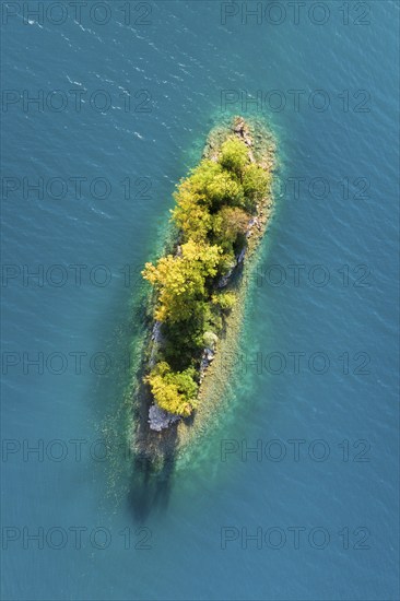 Bird's eye view of the chive island in the turquoise waters of Lake Walen in the canton of St.