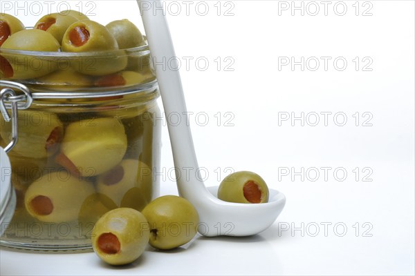 Green olive stuffed with pieces of paprika