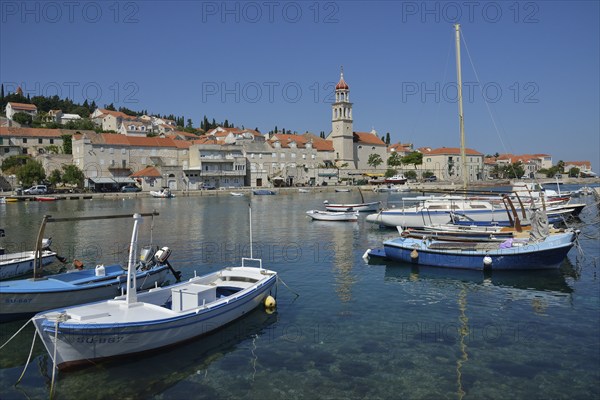 Fishing boats in the harbour in front of the church of Sveti Ivan, St Ivan, Sutivan, Island of
