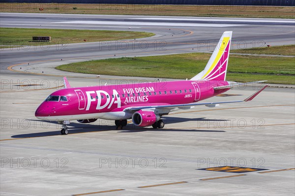 Fuji Dream Airlines FDA Embraer 175 aircraft with registration JA15FJ at Kobe Airport (UKB) in