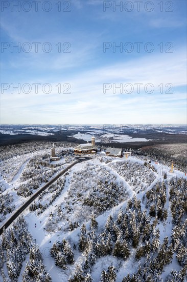 Fichtelberg highest mountain in the Ore Mountains in winter aerial view in Oberwiesenthal, Germany,