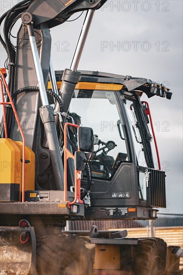 Yellow Volvo tracked excavator on construction site