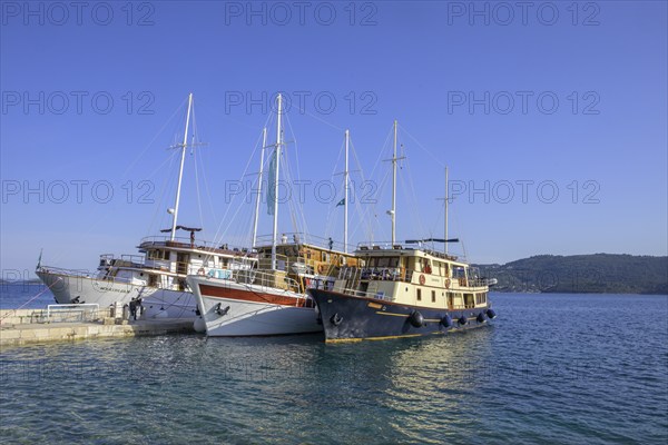 Three ships on the pier, Kucište, Orebic, Pelješac Peninsula, Dubrovnik-Neretva County, Croatia,