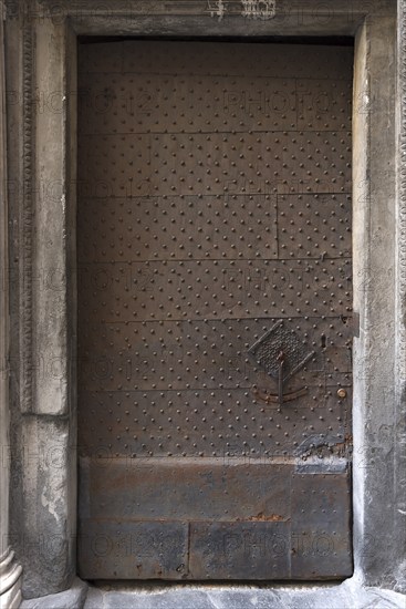 Iron door with door knocker at Palazzo Pinelli Parodi in the historic centre, Piazza Pinelli no. 2,