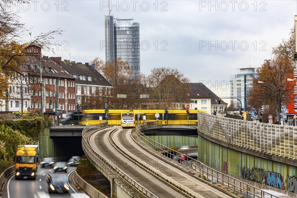 Motorway A40, Ruhrschnellweg, skyline of the city centre of Essen, exit Essen-Huttrop, track bus