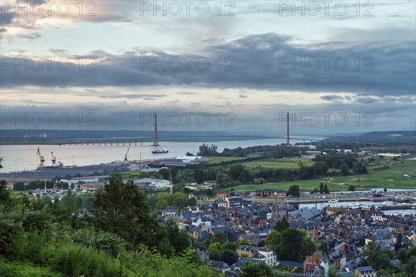 Panoramic view of the houses of the old town and the Seine with the Pont de Normandie cable-stayed