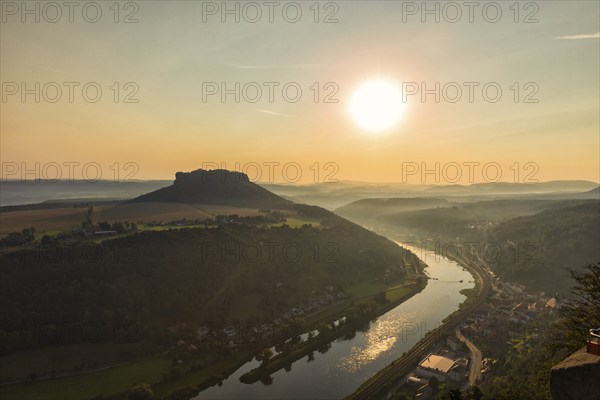 Sunrise at the Lilienstein on Königstein Fortress in Saxon Switzerland The summer heat lies as a