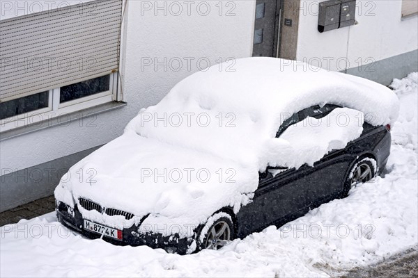 Car, car, snowed in on car park in front of house, fresh snow, heavy snowfall, masses of snow, snow