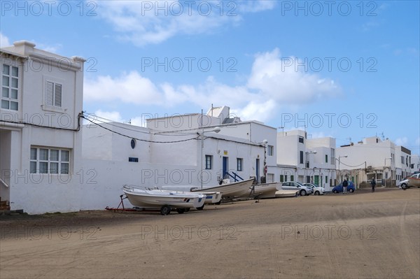 Village street in Caleta de Famara, municipality of Teguise, Lanzarote, Canary Island, Canary