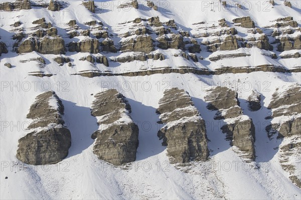 Snow covered Carboniferous mountain slope in autumn, Billefjord, Billefjorden, Svalbard,
