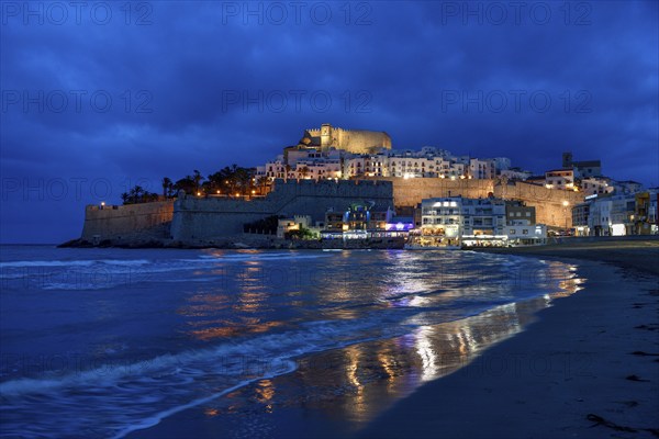 Old town with the Romanesque castle from the 14th century, blue hour, Peñíscola, province