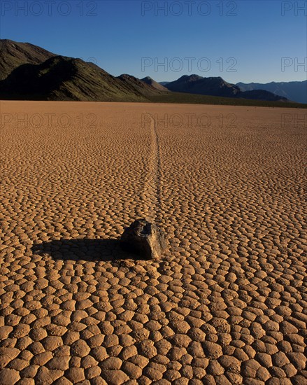 Stone on dried-out earth, Racetrack Valley, Death Valley, California, USA, North America