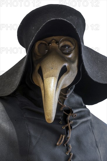 Black wide-brimmed hat, overcoat and beaked mask for plague doctor to treat victims of bubonic