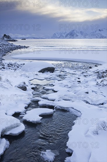 Snow on the beach of Rørvika, Rorvika, Tysfjorden in winter, Austvagoy, Austvågøya, Lofoten,