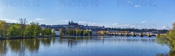 Panorama view of Charles bridge over Vltava river and Gradchany (Prague Castle) and St. Vitus