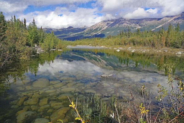 Crystal clear lake reflecting trees and mountains, autumn atmosphere, calendar picture, Copper