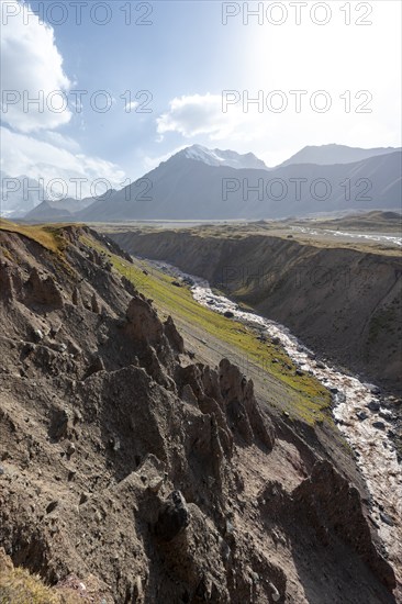 Valley with river Achik Tash between high mountains, mountain landscape with peak Pik Lenin, Osh