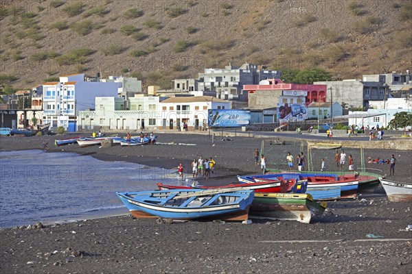 Colourful wooden fishing boats on the black sand beach of Tarrafal de São Nicolau on the island São