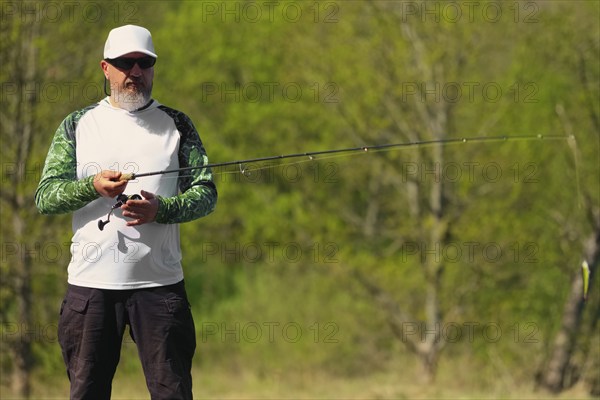 Fisherman with rod ready to make a cast