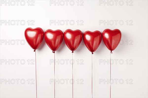 Multiple red heart shaped foil balloons on white background. KI generiert, generiert AI generated