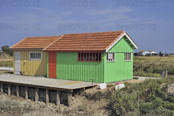 Colourful cabins of oyster farm at la Baudissière near Dolus, Saint-Pierre-d'Oléron on the island