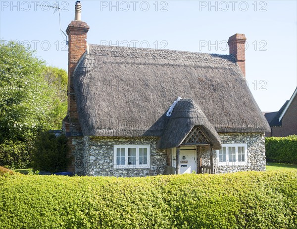 Pretty detached thatch and flint cottage Wilcot village, Wiltshire, England, United Kingdom, Europe