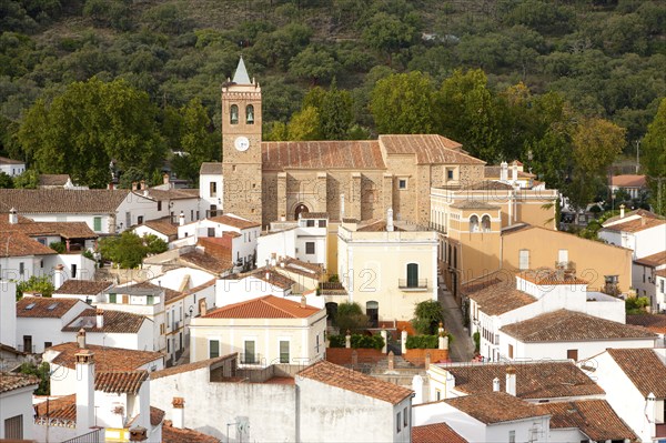 Church and houses in village of Almonaster La Real, Sierra de Aracena, Huelva province, Spain,