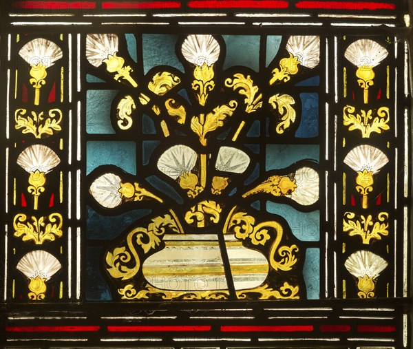 Stained glass window church of Saint John, Saxmundham, Suffolk, England, UK bunch of lilies in bowl
