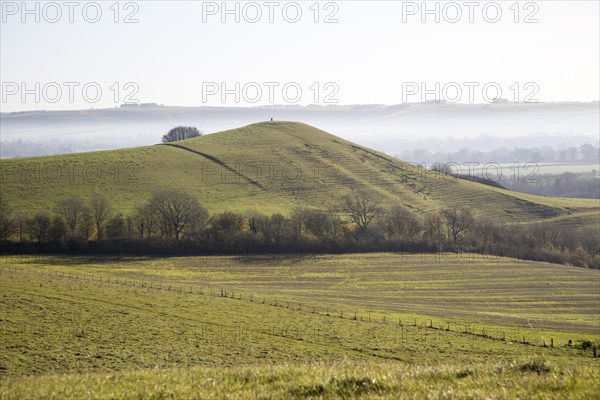 Picked Hill chalk outlier landscape misty valley floor, Vale of Pewsey, from Woodborough Hill,