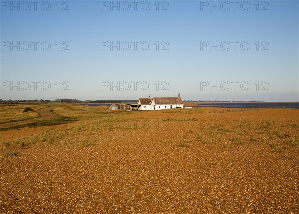 Seaside bungalow on shingle beach near North Weir Point, Shingle Street, Suffolk, England, UK