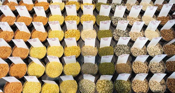 Samples of pulses kept on display inside a shop at a wholesale market ahead of the presentation of