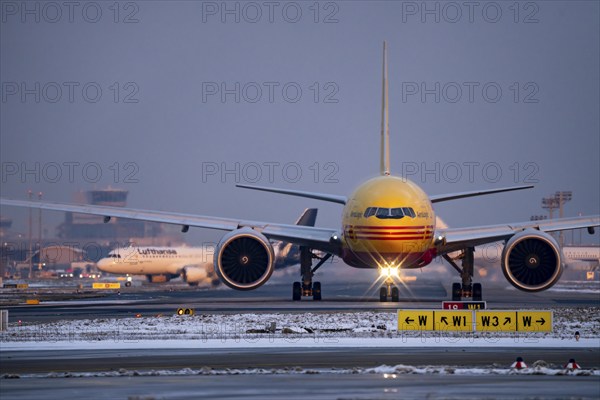 DHL, AeroLogic, Boeing 777F, on the taxiway to Runway West, Frankfurt FRA Airport, Fraport, in