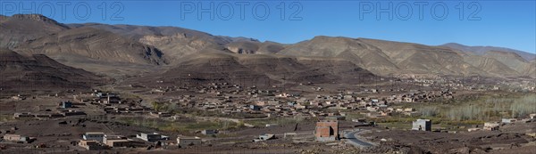 View of Taboulmante with colourful mountains in the background, layered landscape, Gorges du Dades,
