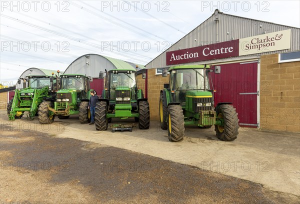 Row of John Deere tractors in farm machinery auction sale, Campsea Ashe, Suffolk, England, UK