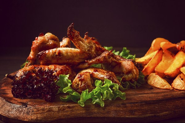 Fried chicken wings, with potatoes, and spices, homemade, fast food, no people