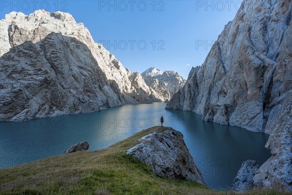 Hiker in front of Kol Suu Mountain Lake, Kol Suu Lake, Sary Beles Mountains, Naryn Province,