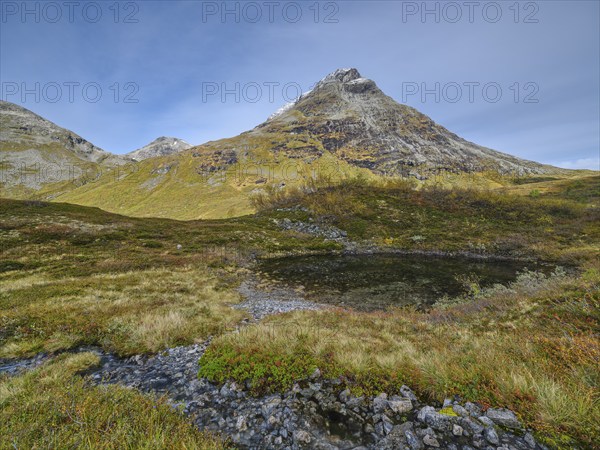 Øvstevatnet with mountain, autumn in Reinheimen National Park, Møre og Romsdal, Norway, Europe