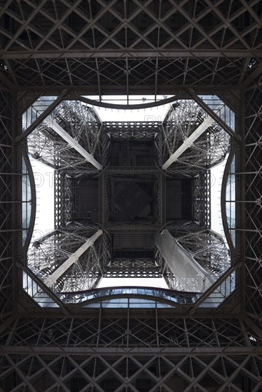View from below of the impressive metal construction, Eiffel Tower, seen from below, mouse