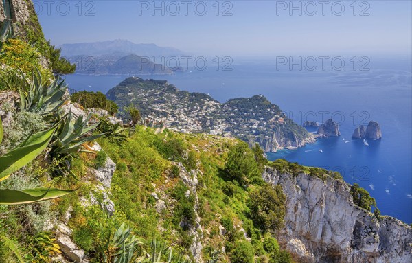 View from Monte Solaro 589m to the south coast with the Faraglioni rocks, the island's landmarks,