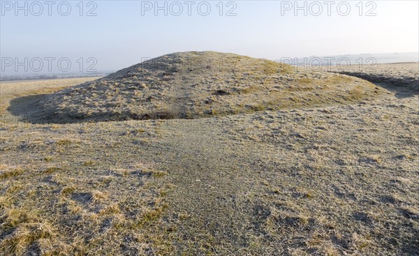 Bronze Age bowl barrow on Windmill Hill, a Neolithic causewayed enclosure, near Avebury, Wiltshire,