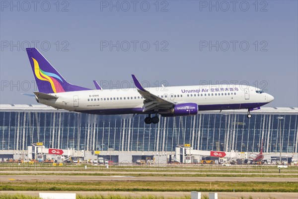 A Boeing 737-800 aircraft of Urumqi Air with the registration number B-6995 at Pudong Airport (PVG)