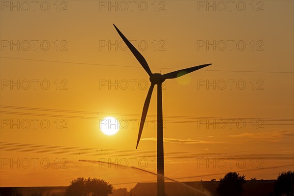 Sunset, wind power plant, field irrigation, silhouettes, Melbeck, Samtgemeinde Ilmenau, Lower