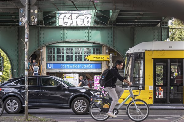 Transport by car, tram and bicycle. Underground station Eberswalder Straße at Prenzlauer Berg in