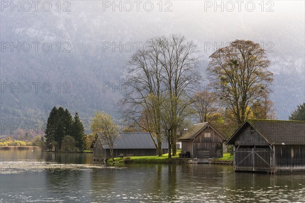 Lake Hallstatt near Steeg. Some boathouses. Autumn, backlight. Lake Hallstatt, Salzkammergut, Upper