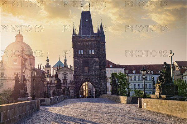 Charles bridge tower in Prague on sunrise, Czech Republic, Europe